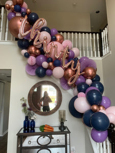 Thirtieth balloon garland in navy, purple, pink and rose gold.  Indoor balloon garland install on stairwell.